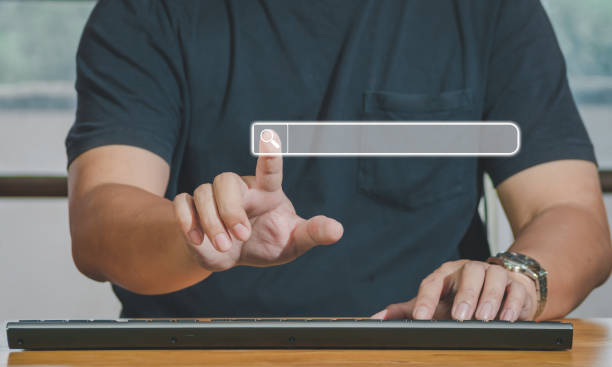 istock Hand of man touching searching browsing icon for internet data information networking. The blank search bar screen background, business and technology, web banner,search engine concept. 1434452219