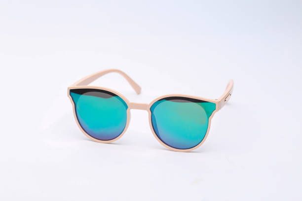 istock Stylish sunglasses with turquoise glass reflection isolated on white background 1434452442