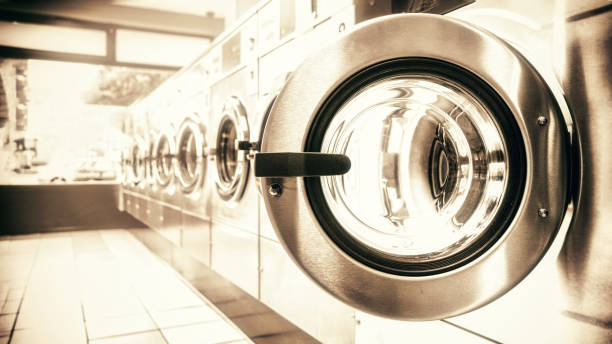 istock Washing machines in a row in a public laundry center 1434452446