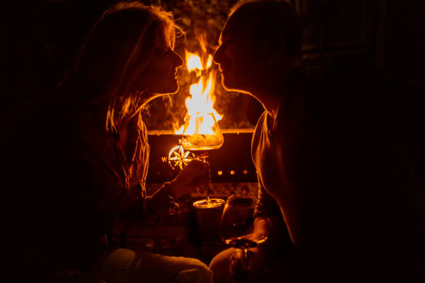 istock Couple at a BBQ fire in an evening garden 1434454184