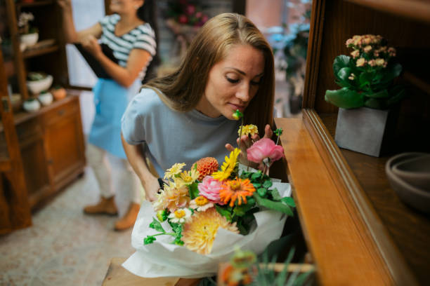 istock Female florist enjoying her work 1434456933