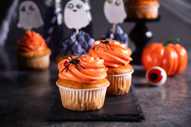 istock Festive Halloween cupcakes decorated with sprinkles and candy spider 1434458051