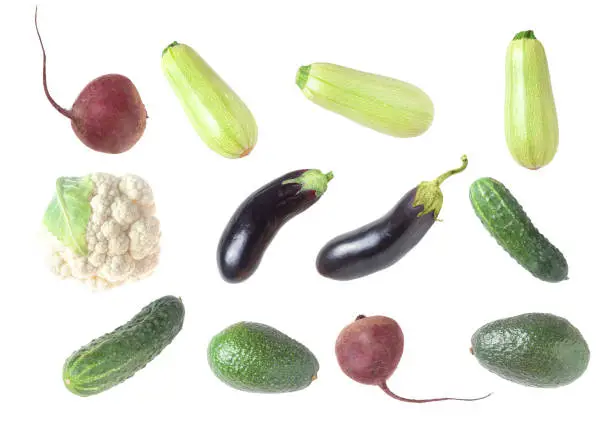 Zucchini, cucumber, eggplant, avocado, cauliflower and beets close-up on a white background - collage vegetables