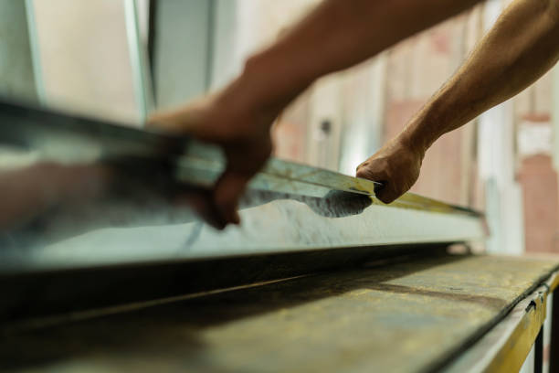 istock Employe of a locksmith are working on cutting material 1434463466