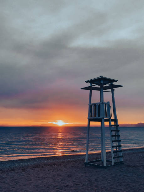 Scenic view of a sunset and a lifeguard tower from a beach in Greece, Athens,