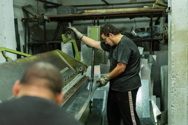 istock Employe of a locksmith are working on cutting material 1434463696