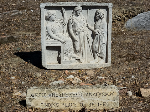 Cast of an Athenian marble votive relief of Demeter, Persephone and a high priest of their cult in situ at the Temple of Olympian Zeus in Athens, Greece