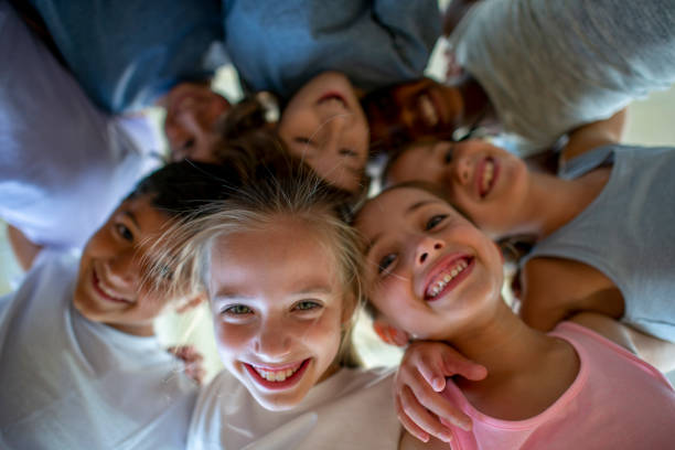 istock Children Putting Their Heads Together 1434467867
