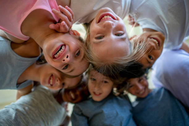istock Children Putting Their Heads Together 1434467908