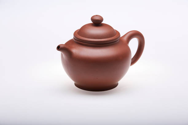Set of antique Chinese Tea pot cup isolated on white background. Vintage porcelain Japanese teapot with teacup on white table, Asian drink lifestyle concept. China coffee mug, top view