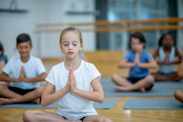 istock Children Meditating in a Gymnasium 1434471940