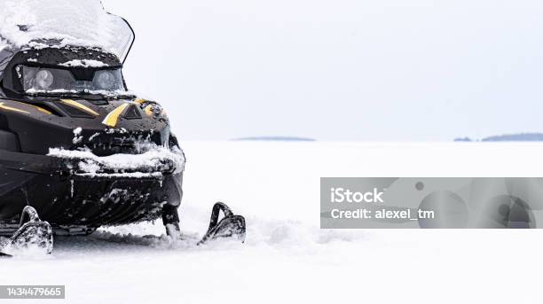Panoramic Background With Snowmobile On Ice Of Frozen Lake On Winter Day Stock Photo - Download Image Now