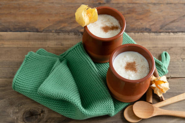 istock Bowls of rice pudding and cinnamon on a wooden background. Copy space. 1434480835