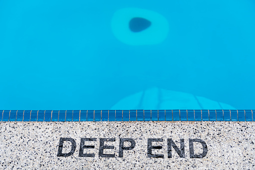 Steam Rising from Heated Swimming Pool with Concrete Deck