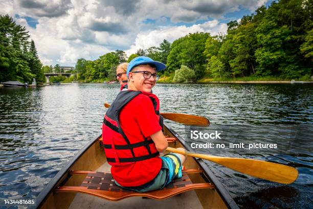 Mother And Her Son Are Canoeing At Fairy Lake In Huntsville In Canada Stock Photo - Download Image Now