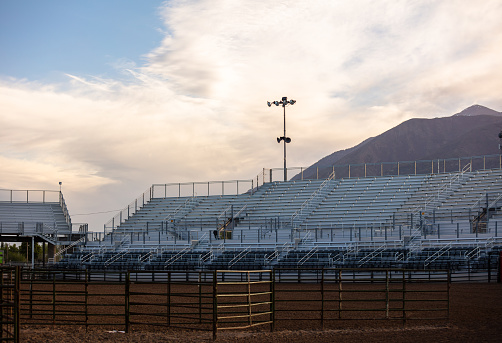 Sunlight on the empty stands at a rodeo arena in the Juab County Fairgrounds in Nephi, Utah.