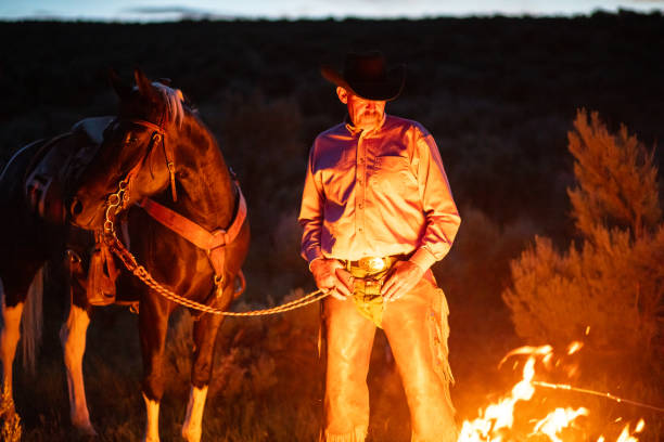 istock Cowboy In Front Of Campfire 1434482530