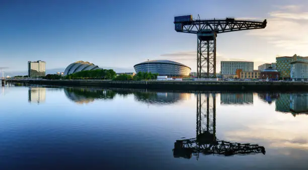 Glasgow panorama at dramatic sunrise with Clyde river, Scotland