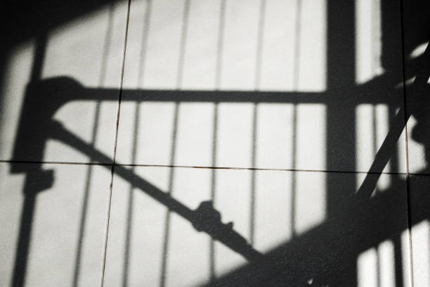 istock Black abstract lines shadows on tiled floor or building wall 1434485935