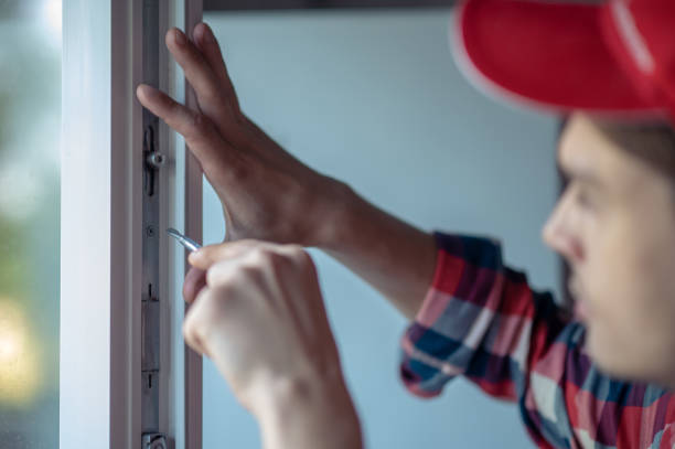 istock Skilled young Caucasian serviceman repairing the window 1434487510
