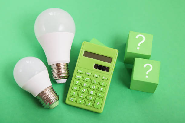 istock Light bulb, Green calculator, question mark on green background. Concept of competition for Green Energy market 1434490055