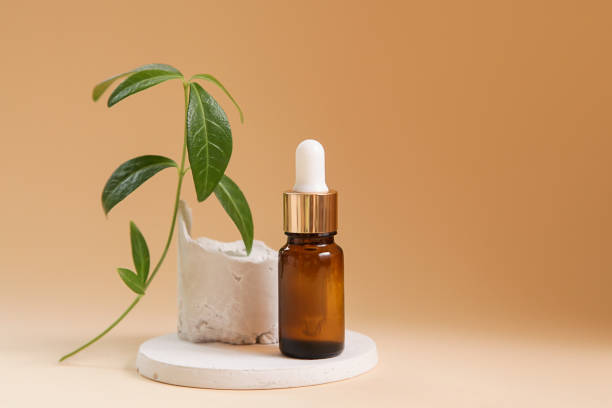 istock Aromatherapy concept. Essential oil bottle, mock up. Spa on pastel beige background. Podium presentation cosmetics. Minimal style composition, copy space. 1434490872