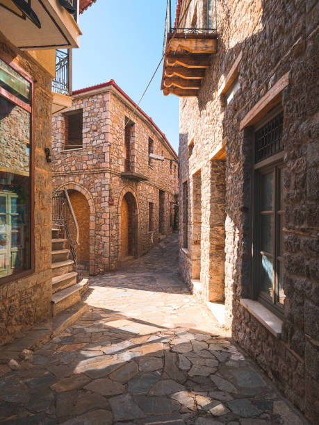 Quaint Cobbled Street in Arachova Narrow cobbled streets of resort town of Arachova on the slopes of Mount Parnassus, Greece arachova greece stock pictures, royalty-free photos & images