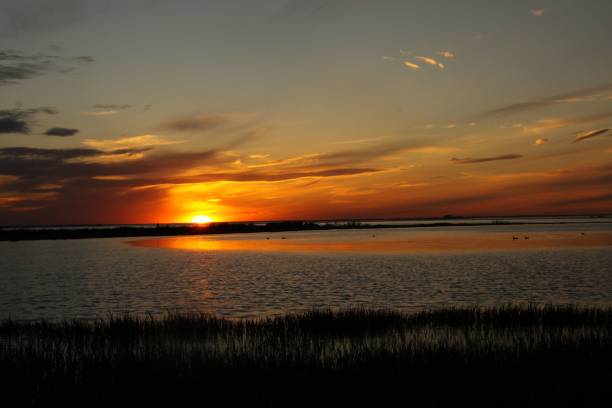 istock Scenic view of dramatic sunset over a lake 1434491834