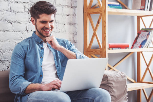 istock Young man with gadget at home 1434492653