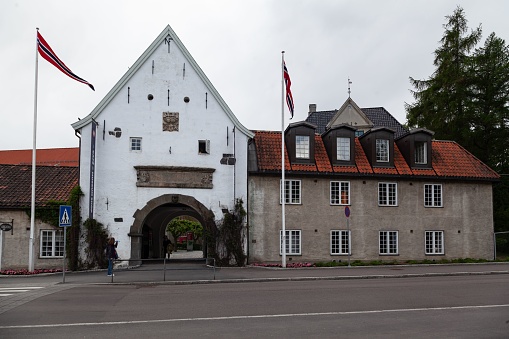 Oslo, Norway – June 06, 2013: A facade of a historical building with flags in Oslo, Norway