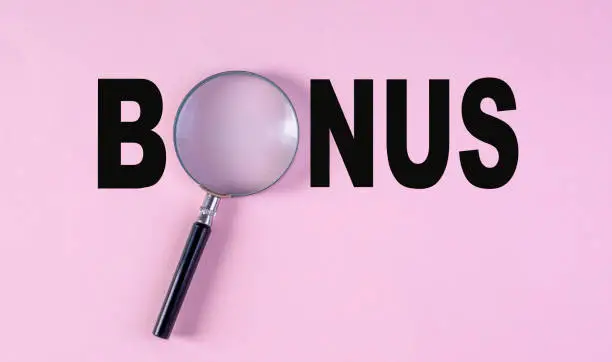 Photo of Bonus Type On Pink Background.