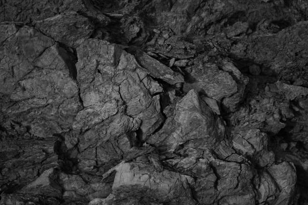 istock Black white rock texture. Close-up. Dark gray stone background for design. 1434500412