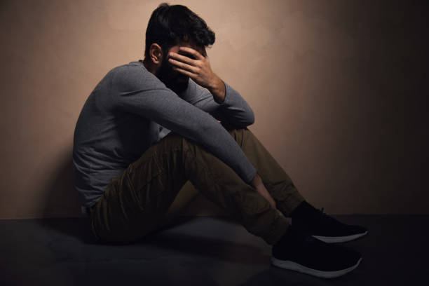 istock Man sadly sitting on the floor 1434505119
