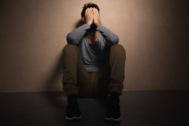 istock Man sadly sitting on the floor 1434505124