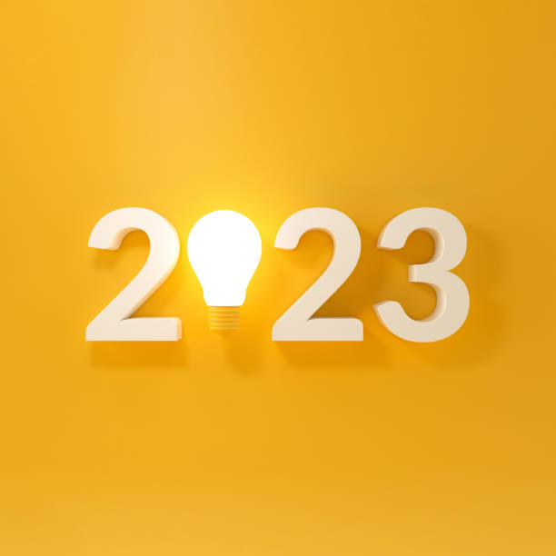 istock Bulb light with new year 2023 on yellow background. 1434505235