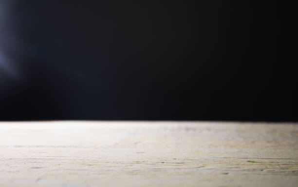istock wooden table and black background 1434505276