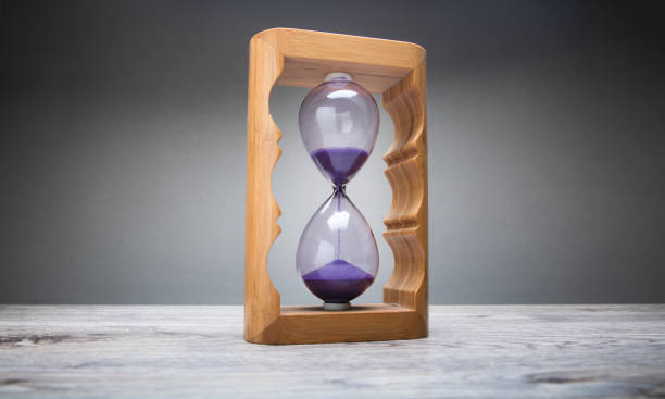 istock Hourglass on a gray background 1434505320