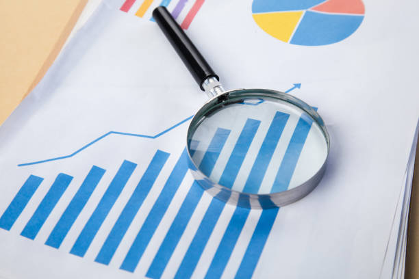 istock Growing chart and magnifying glass on paper 1434505347