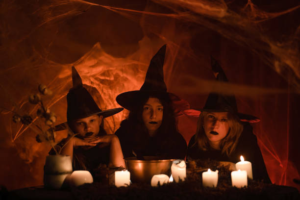 istock Three young witches near the ritual cauldron. 1434505628