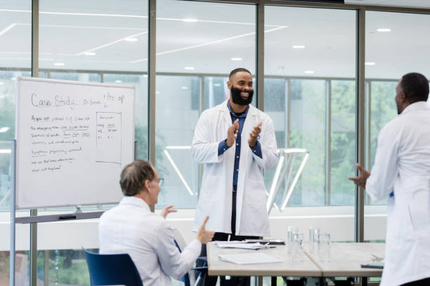 istock Lead surgeon meets with peers 1434508999