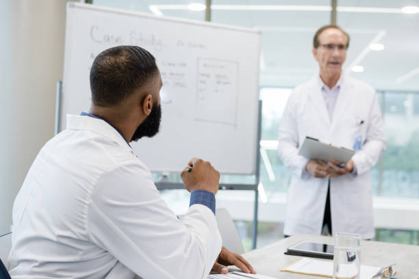istock Doctor listens to the speaker 1434509001