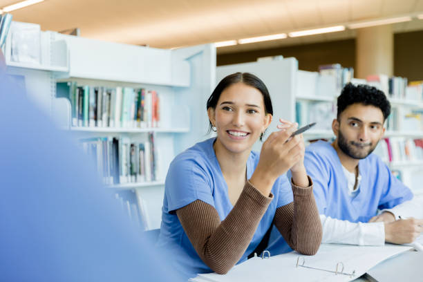 istock Two nursing students listen to unrecognizable friend 1434510111