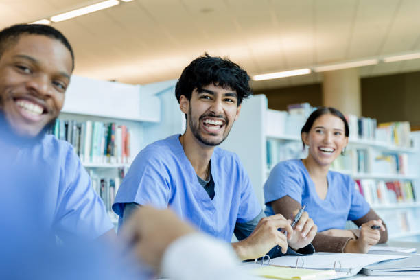 istock Nursing students laugh at unrecognizable friend's jokes 1434510123