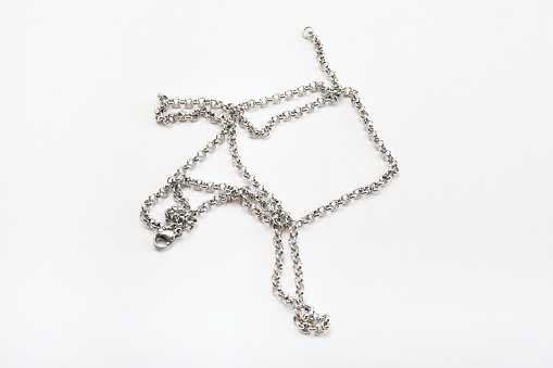 Silver chain necklace on the white background