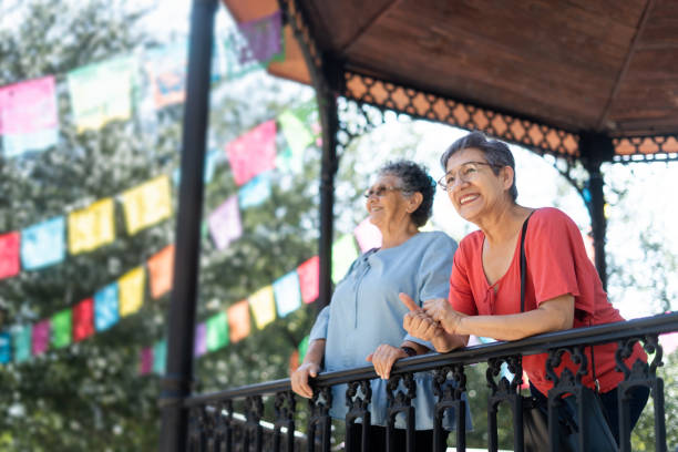 istock Two retired women standing outside and looking away 1434511421