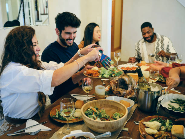 istock Group of Friends Celebrating Thanksgiving 1434511597