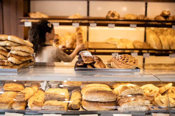istock Bakery shop interior and freshly baked pastries and bred on shelf. 1434513532