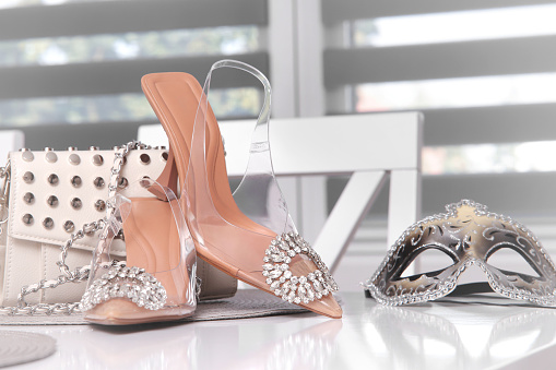 Female wedding shoes with a bag and a mask