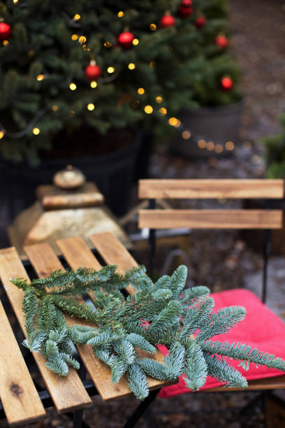 istock Christmas tree branch on wooden table 1434515551