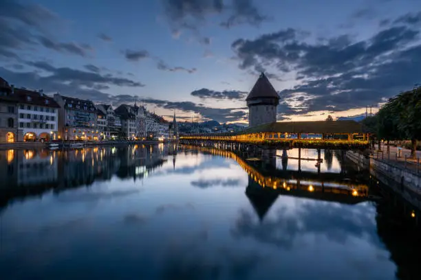 Sunrise over the beautiful downtown district of Lucerne, which is known for its medieval architecture, and the beautiful Reuss River.